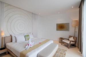 Voodi või voodid majutusasutuse Svarga Resort Lombok toas