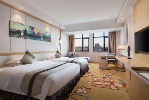 Postel nebo postele na pokoji v ubytování Ramada Plaza by Wyndham Enshi + 32 fotografií