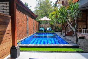 a swimming pool in the backyard of a house at D'Tegal House in Nusa Lembongan