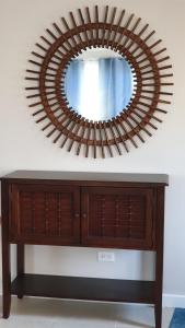 a large wooden mirror on top of a dresser at Bahama Breezes in Georgetown