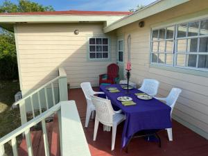 a table with a purple table cloth on a patio at Bahama Breezes in Georgetown