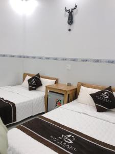 Giường trong phòng chung tại Hoa Trang Hotel