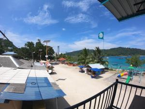 a view of a beach with a playground at Perhentian Damia in Perhentian Island
