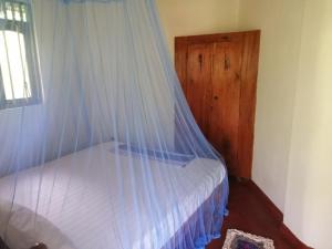 Postel nebo postele na pokoji v ubytování Calm Garden Cabanas