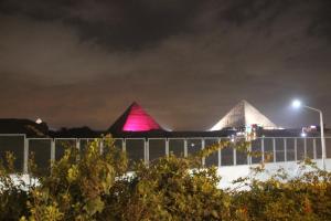 a view of the pyramids at night at Farida Pyramids Boutique Hotel in Cairo