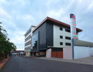 a building with a large window on the side of it at Hotel Samrat in Taliparamba