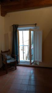 a room with a window and a toilet in it at Alighieri Loft in Florence