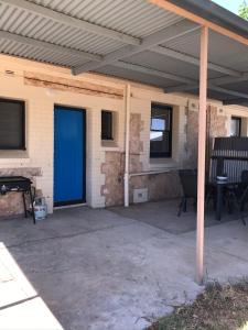 a patio with a blue door on a house at Cute and Cosy II - Events, Workers, Getaways. in Murray Bridge
