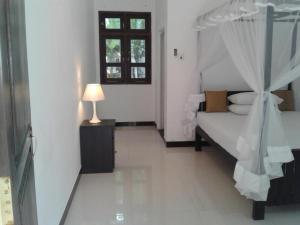 Postel nebo postele na pokoji v ubytování Apna Homestay Apartments