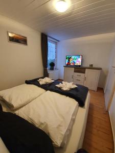 Postel nebo postele na pokoji v ubytování FeWo-Butze 2 mit Terrasse