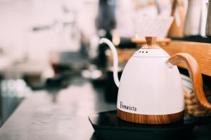 a tea kettle sitting on top of a table at Dali Blocks · Cafe & Travel Hotel in Dali