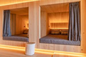 Letto o letti in una camera di Stadtvilla Schladming Boutiquehotel