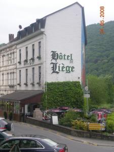 a building with a sign on the side of it at Le Liège in La Roche-en-Ardenne