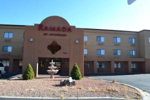 a building with a fountain in front of it at Ramada by Wyndham Santa Fe in Santa Fe
