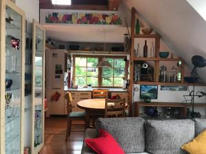a living room with a couch and a table at Ferienwohnung Wremer Straße in Wremen
