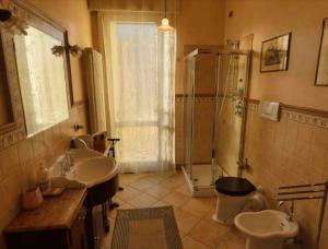 a bathroom with two sinks and a shower at Casa di Anna in Ravenna