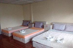Postel nebo postele na pokoji v ubytování Ban Tonnam Resort