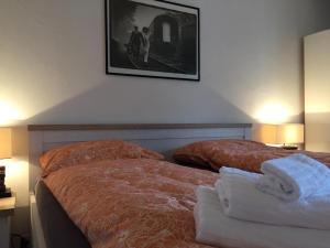 Ein Bett oder Betten in einem Zimmer der Unterkunft Hotel Ristorante LIDO