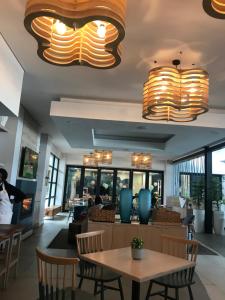 a restaurant with a table and chairs and lights at The Blyde Crystal Lagoon Cologne4 in Pretoria