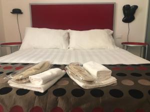 En eller flere senge i et værelse på Room 76