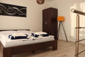 Posteľ alebo postele v izbe v ubytovaní Apartmán Olaf Tatranská Lomnica