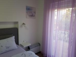 Katil atau katil-katil dalam bilik di Apartman Luka