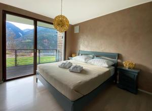 Posteľ alebo postele v izbe v ubytovaní VILLA COLLINA VERDE