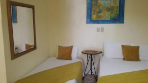 Postel nebo postele na pokoji v ubytování Hotel Magic Tropical