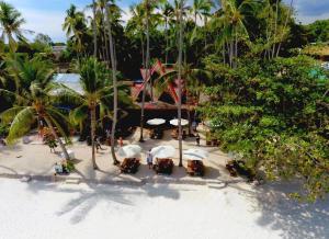 an aerial view of a beach with tables and umbrellas at Pyramid Resort in Panglao