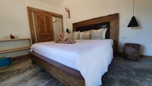 Postel nebo postele na pokoji v ubytování KALUME' Eco Boutique Resort-Adult only