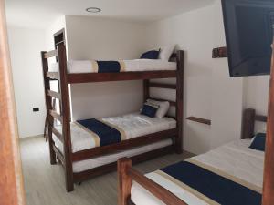 Postel nebo postele na pokoji v ubytování Hotel Palmi