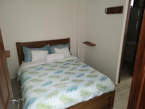 Postel nebo postele na pokoji v ubytování Hotel Palmi