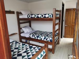 Postel nebo postele na pokoji v ubytování Hotel Palmi