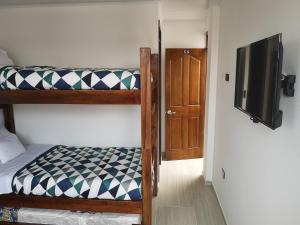 Postel nebo postele na pokoji v ubytování Hotel Palmi