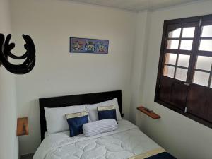 Postel nebo postele na pokoji v ubytování Hotel Palmi