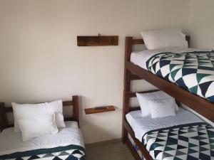 Postel nebo postele na pokoji v ubytování Hotel Palmi