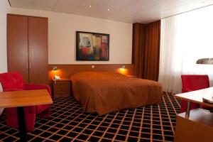 Postel nebo postele na pokoji v ubytování City Hotel Bergen op Zoom