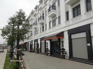 a large white building with a street in front of it at Khanh Phong Apartment PG02-20 in Hai Phong