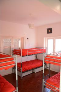 a group of bunk beds in a room at AirPorto Hostel in Maia