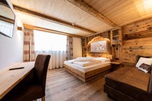 Postel nebo postele na pokoji v ubytování Garni Hotel Residence Diamant