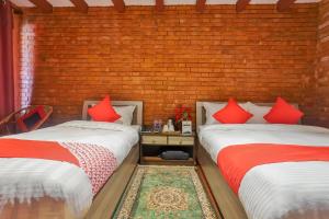 Postelja oz. postelje v sobi nastanitve Kathmandu Cottage - Boutique