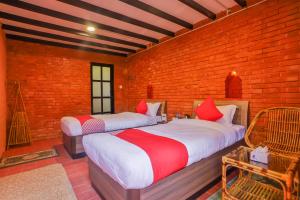 מיטה או מיטות בחדר ב-Kathmandu Cottage - Boutique