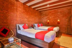 Kathmandu Cottage - Boutique tesisinde bir odada yatak veya yataklar