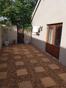 a stone walkway in front of a building at El Shaddai in Darling