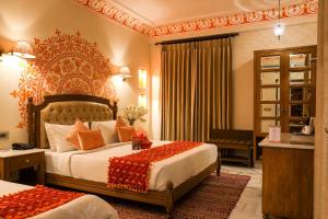 Laxmi Palace Heritage Boutique Hotel客房内的一张或多张床位