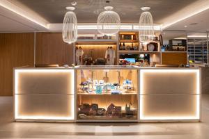 a display case in a kitchen with lights at INNSiDE by Meliá Zaragoza in Zaragoza