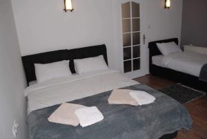 Кровать или кровати в номере Stan na dan - apartman Djordjevic
