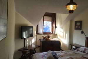 Posteľ alebo postele v izbe v ubytovaní Maison des Alpes mansarda