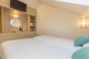 Postel nebo postele na pokoji v ubytování Center Parcs Les Ardennes