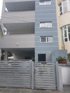 a building with a fence in front of it at Julia's Residence in Nicosia